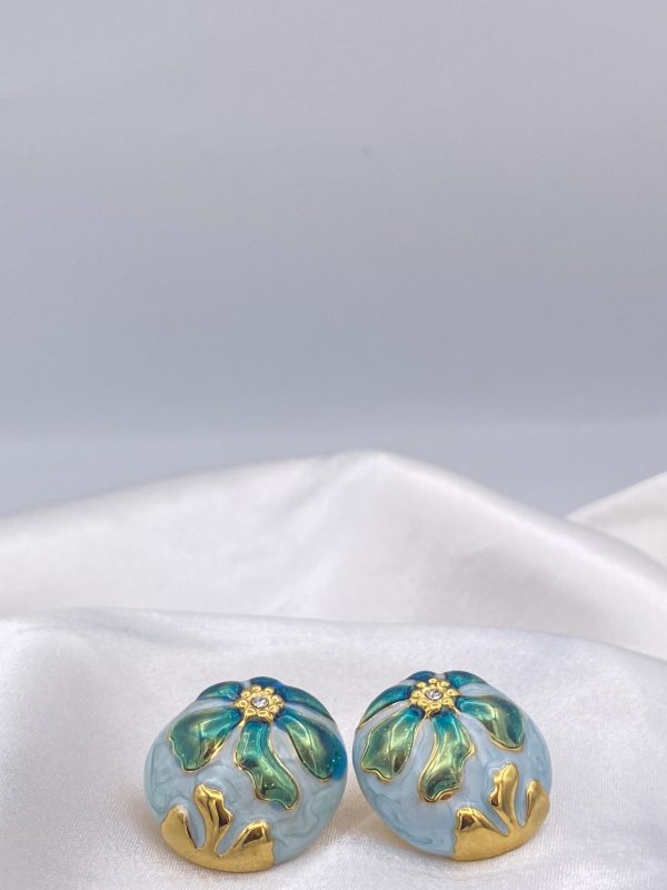 Boucle d'oreille fleur bleu