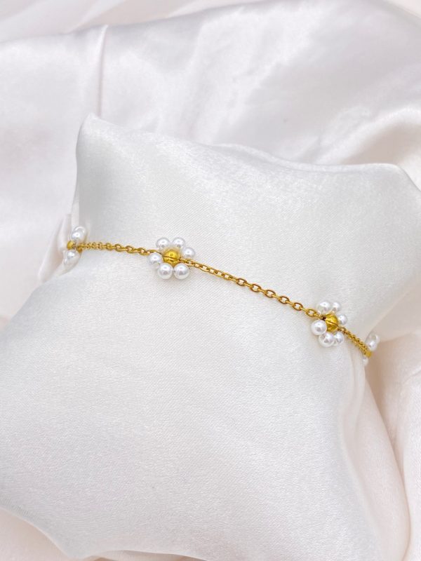 Gourmette petites fleurs blanche